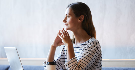 A woman looking introspectively